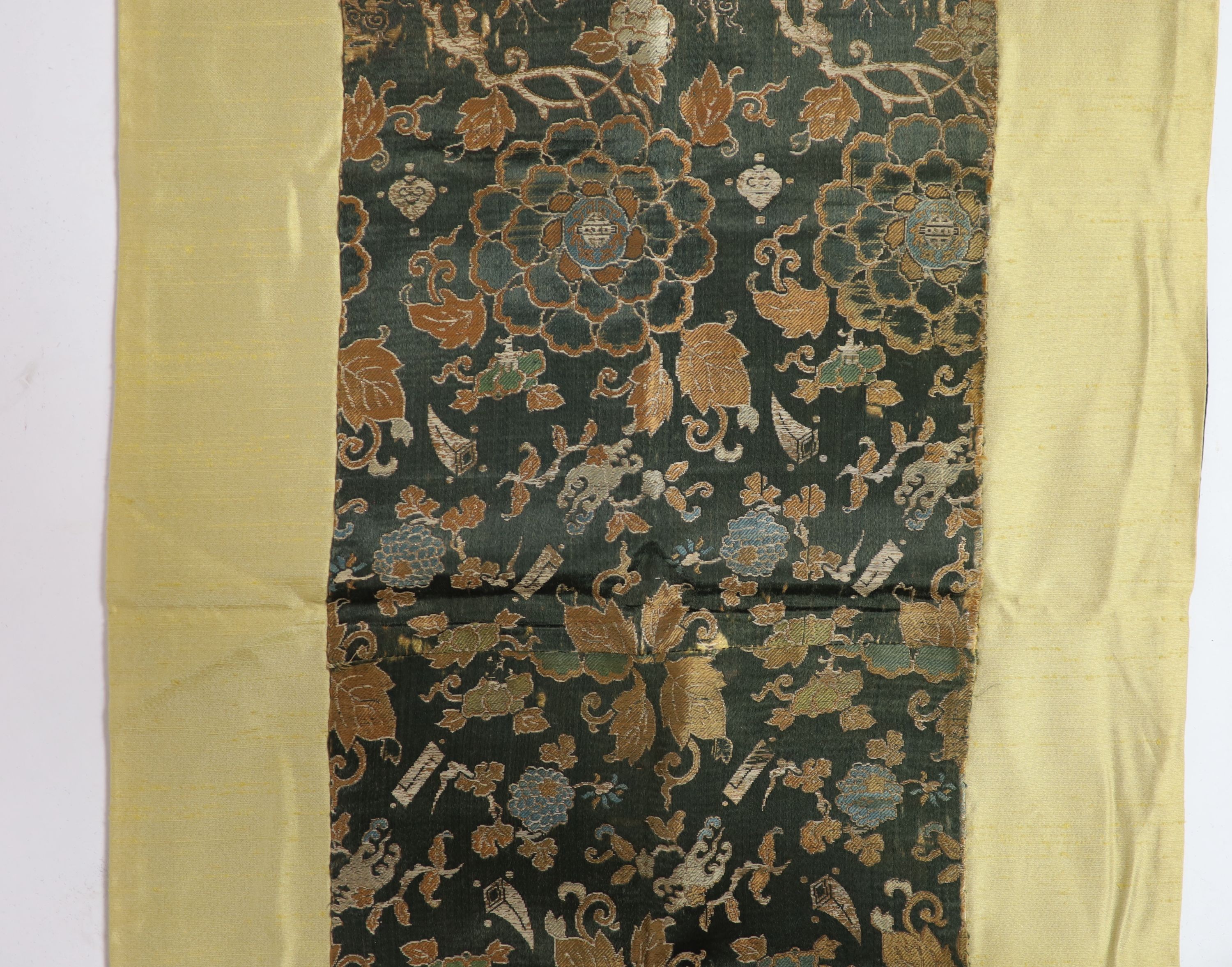 A Chinese brocade panel, 17th/18th century, Total size 169cm x 54cm